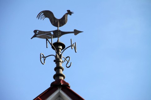 Weathercock on a roof in Lothe