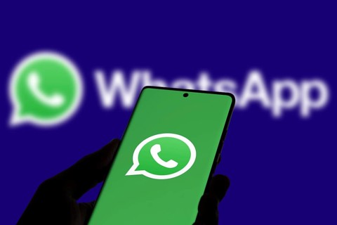 WhatsApp logo is displayed on smartphone.