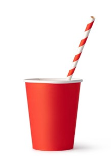 Red cardboard cup with a straw. Isolated on a white
