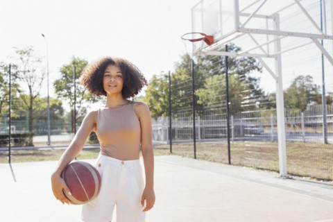 Mixed-race young smiling female outdoors and having fun. Stylish cool teen girl gathering at