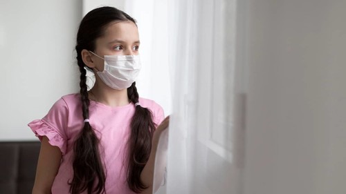 Medium shot girl wearing medical mask