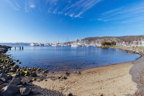 HOBART, AUSTRALIA, SEPTEMBER 15, 2022: A view towards Sandy Bay from Errol Flynn Reserve on a