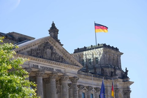 The German flag flies over the Reichstag building in Berlin The German flag flies over the