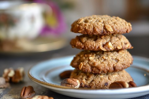 Four stacked biscuits made from bananas, nuts and oatmeal on a plate, AI generated, AI generated