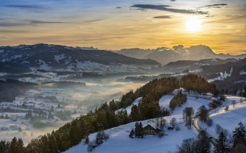 Dreamlike winter landscape at sunset with a view from the Allgäu Alps over the Bregenzerwald in