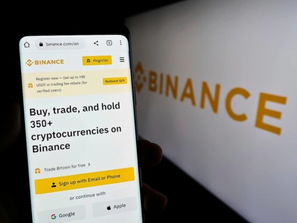 Stuttgart, Germany, 03-31-2023: Person holding cellphone with webpage of crypto exchange company