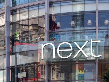Manchester, united kingdom, 24 march 2022: sign on the front of the next clothing store in exchange