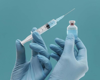 Vaccine bottle syringe held by doctor with gloves. Resolution and high quality beautiful photo