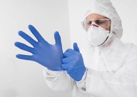 Doctor wearing face mask surgical gloves