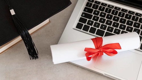 Certificate with ribbon bow laptop