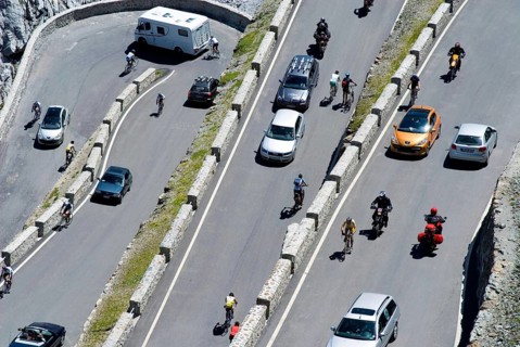 Stelvio Pass, much traffic in the summer season, busy and crowded with pedestrians, bikers, cars,