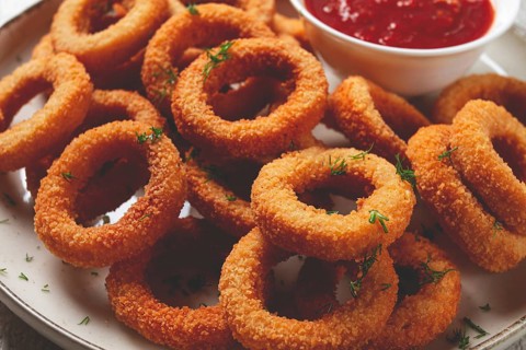 Food, Deep fried onion rings, appetizer, with tomato sauce, on a light background, no people,
