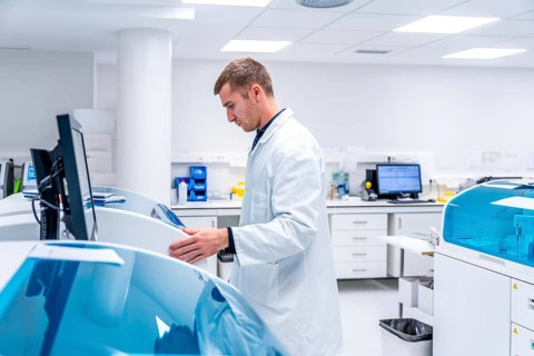 Doctor using innovative machine in a pathological anatomy laboratory research in an hospital