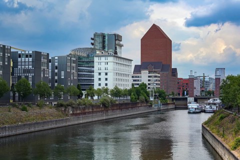 Inner harbor of Duisburg, Germany with the State archive of North Rhine-Westphalia, the monumental