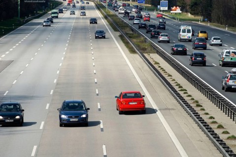 Ghost driver in red BMW driving wrong direction on three lane freeway, Autobahn A8 east of Munich,