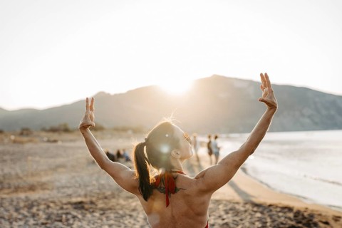 Woman relaxing in a bikini on the beach, Greece, Europe