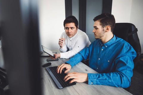 IT Programmer Working on Desktop Computer. Male Specialist Creating Innovative Software Engineer
