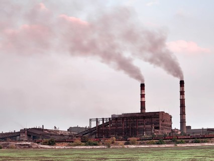 Industrial landscape with factory chimney