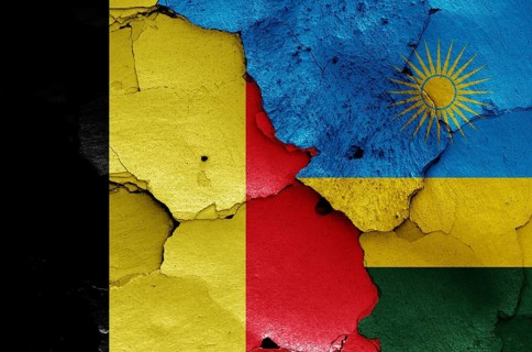 Flags of Belgium and Rwanda painted on cracked wall