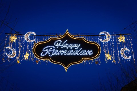 The illuminated lettering Happy Ramadan shines on the evening of 10 March 2024 as part of a light
