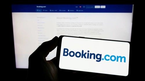 Stuttgart, Germany, 10-24-2022: Person holding smartphone with logo of Dutch online travel agency