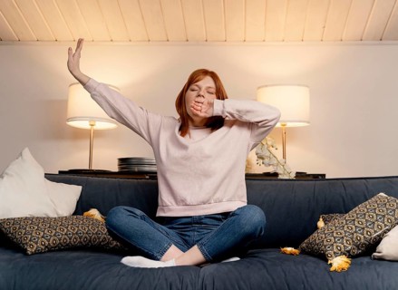 Portrait woman home yawning