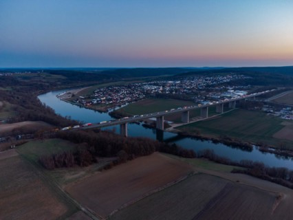 Aerial drone view of heavy traffic jam on German Autobahn bridge over Danube river near Sinzing,