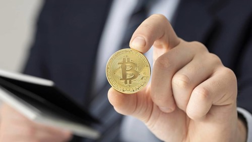 Businessman holding bitcoin close up. Resolution and high quality beautiful photo