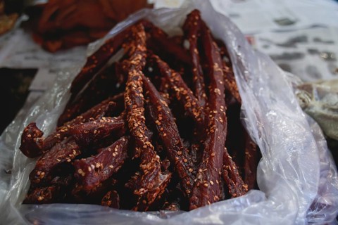 Close up to a bag of traditional cambodian beef jerky called sach ko ngeat sold in the local Samaki