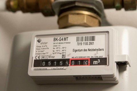 Symbolic image of energy costs in the household, natural gas, analogue gas meter in a flat,