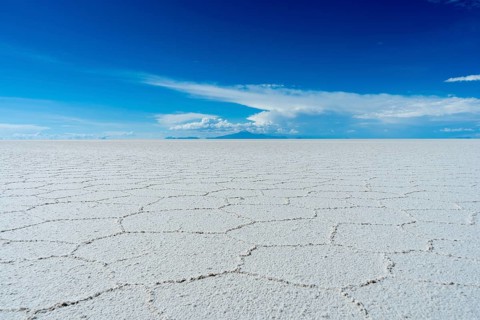 Uyuni Salt Flats on Sunny Day. Salar De Uyuni. Altiplano, Bolivia. Dry Season. Hexagonal Salt