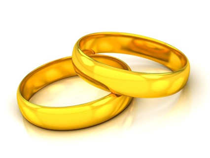 Golden wedding rings on a white beckground