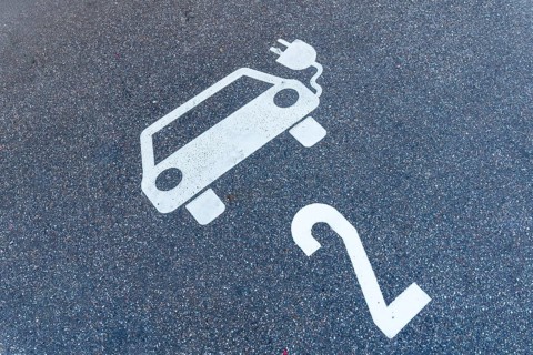 parking lot for electric cars, pictogram of a car with a plug and number 2 on the floor