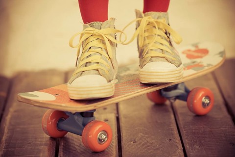 Legs of skateboarder. Closeup view