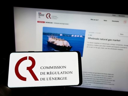Stuttgart, Germany, 08-27-2022: Person holding cellphone with logo of French Commission de