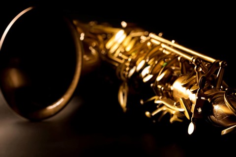 Tenor sax golden saxophone macro with selective focus on black