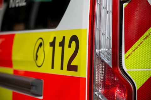Close-up of the emergency number 112 on a DRK (German Red Cross) ambulance