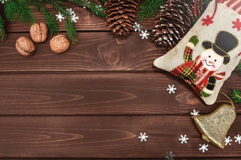 Christmas background Fir branches, cones and nuts on a wooden table. Space for text, View from