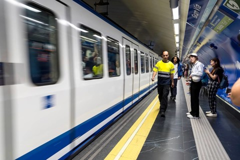 At Almudena Madrid's Puerta de Atocha?Almudena Grandes station, commuters await trains amidst