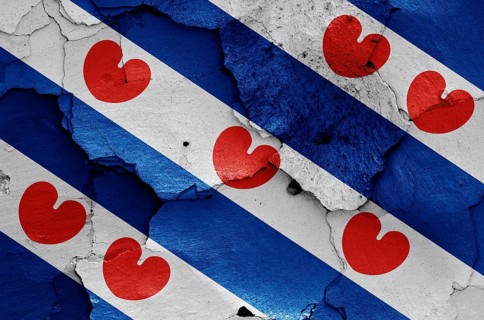 Flag of Friesland painted on cracked wall