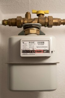 Symbolic image of energy costs in the household, natural gas, analogue gas meter in a flat,