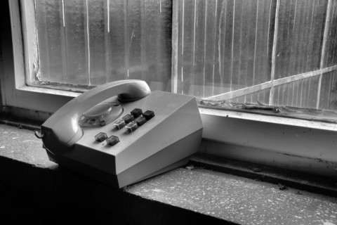 Old telephone in a disused factory