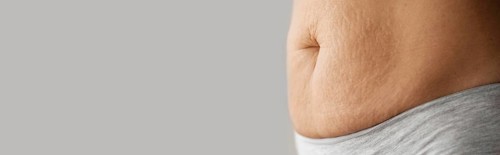 Close up woman belly with copy space