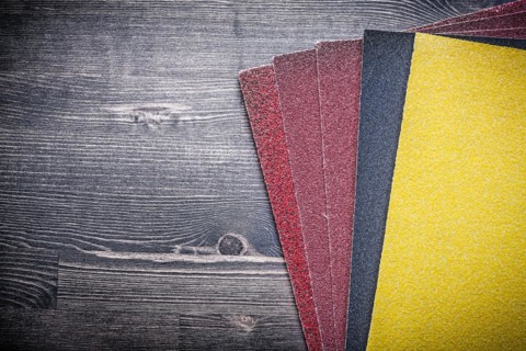 Sandpaper on old wooden board Sanding tools