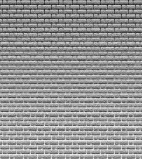 A grayscale pattern of uniform bricks forming a seamless wall with a repeating textured design