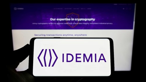 Stuttgart, Germany, 09-09-2022: Person holding smartphone with logo of technology company IDEMIA