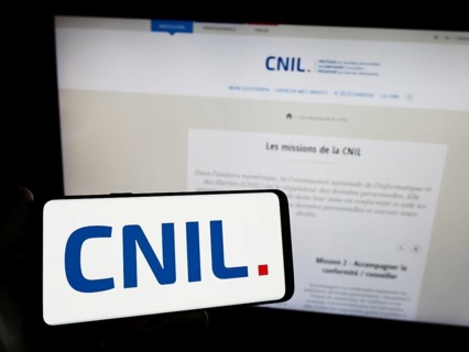Stuttgart, Germany, 11-21-2023: Person holding smartphone with logo of Commission Nationale de