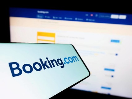 Stuttgart, Germany, 10-24-2022: Cellphone with logo of Dutch online travel agency Booking.com on