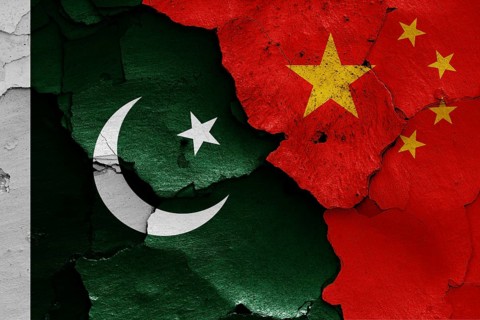 Flags of Pakistan and China painted on cracked wall