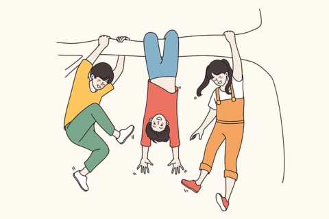 Celebrating Children Day and childhood concept. Happy smiling Children hanging on tree branch